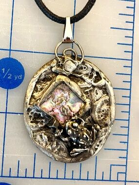 Handmade pendant with attached frog and mother of pearl